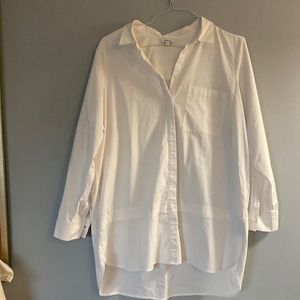 Reitman’s white button-down blouse with rollup sleeves